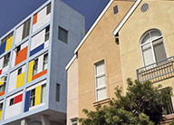 Red, white, blue and yellow color blocks on Metro-Hollywood and the beige stucco of Carlton Courts.